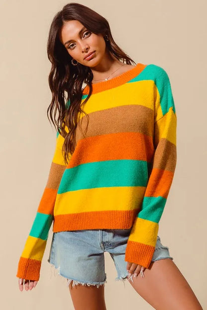 Front view of Sunny Multi Color Stripe Sweater with ribbed detail and round neckline in vibrant stripes.