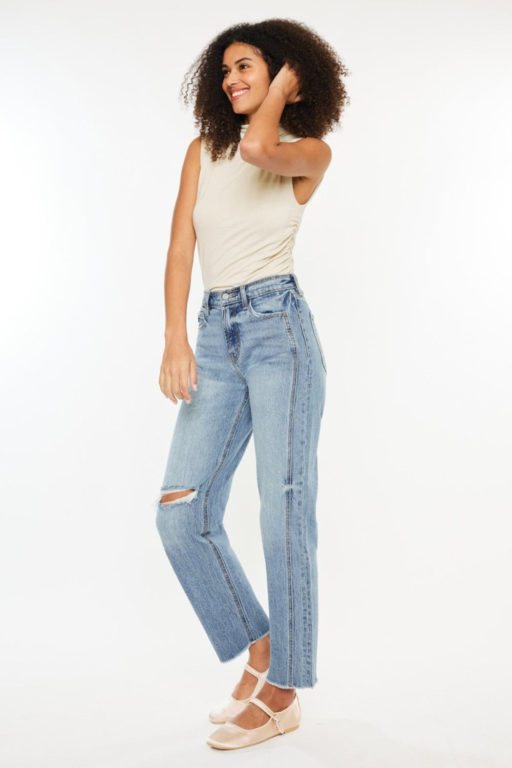 Ultra High Rise Distressed Straight Jeans in medium stone wash with distressing, raw hem, and 90s-inspired boyfriend fit. Slightly stretchy with a 5-pocket design and zipper fly.