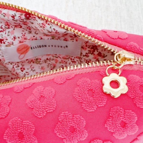 Pink Embossed Daisy Blossom Cosmetic Case with zipper open showing roomy inside.