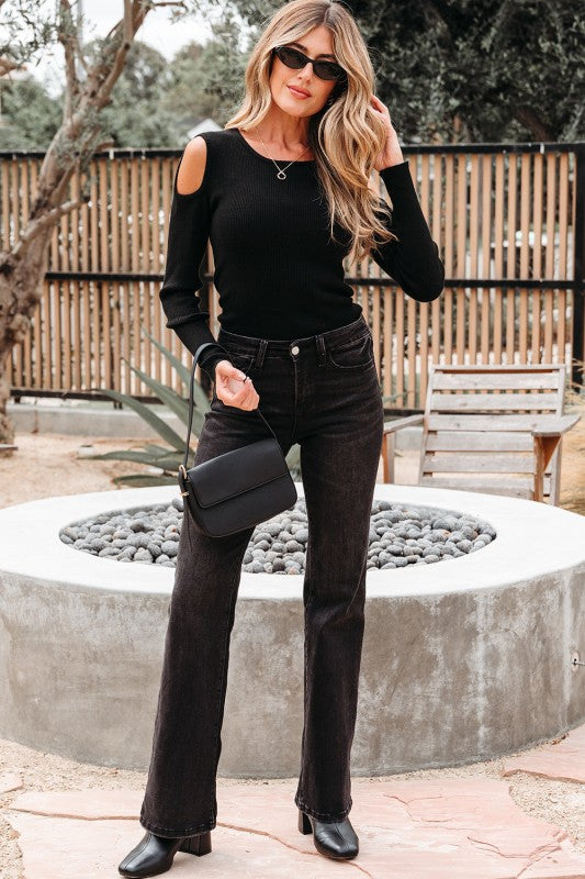 Full body shot of model wearing Amaya Ribbed Knit Cold Shoulder Sweater.