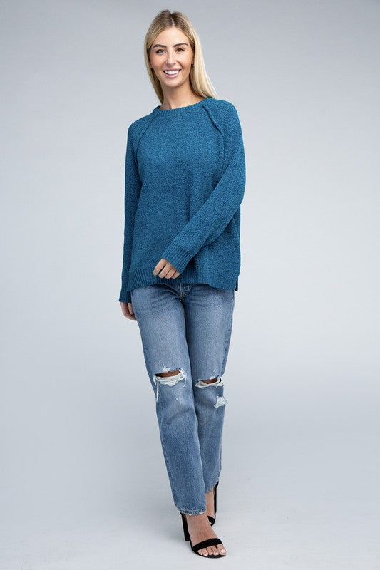 Ocean teal round neck chenille sweater with long raglan sleeves, relaxed fit, and hip-length cut.