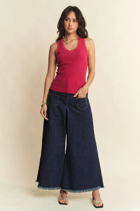 Front view of woman wearing Laney Wide Leg Culotte Jeans styled with tank and sandals.