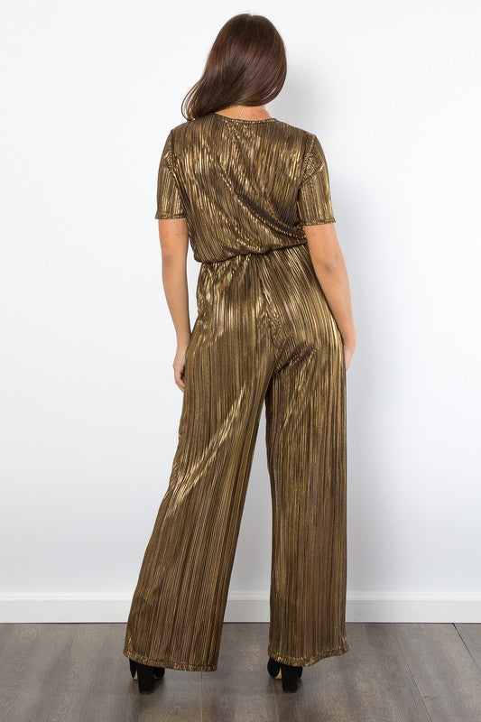 Gold Foil Accent Jumpsuit features a V-neck, short sleeves, pleats, foil details, wide-leg, and pockets.