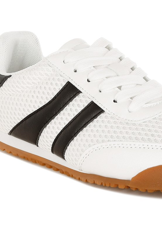 Close-up side view of white Blaster sneaker highlighting black contrast stripes and breathable mesh upper – sporty casual design by Rag Company
