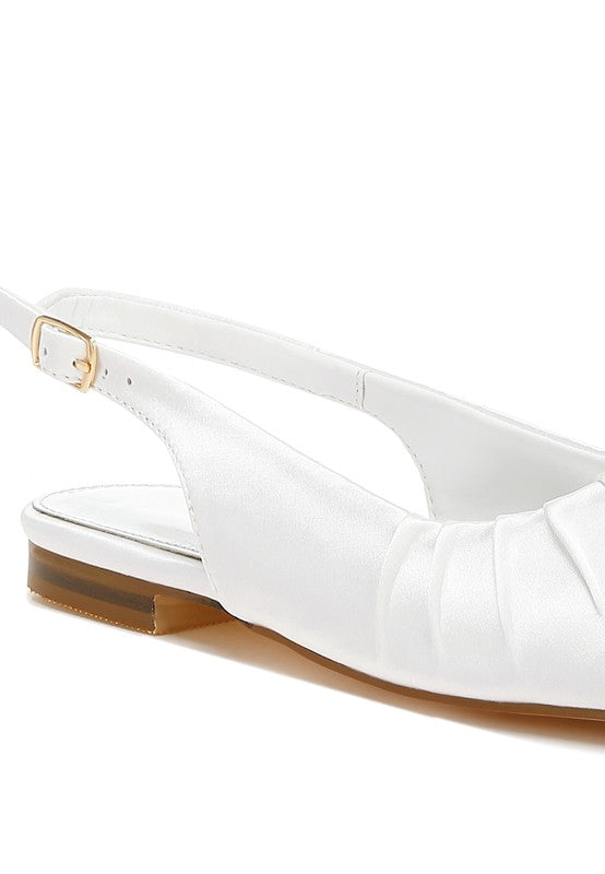 White satin slingback shoes with square toe, adjustable buckle strap, flat heel, and plush cushion insole.