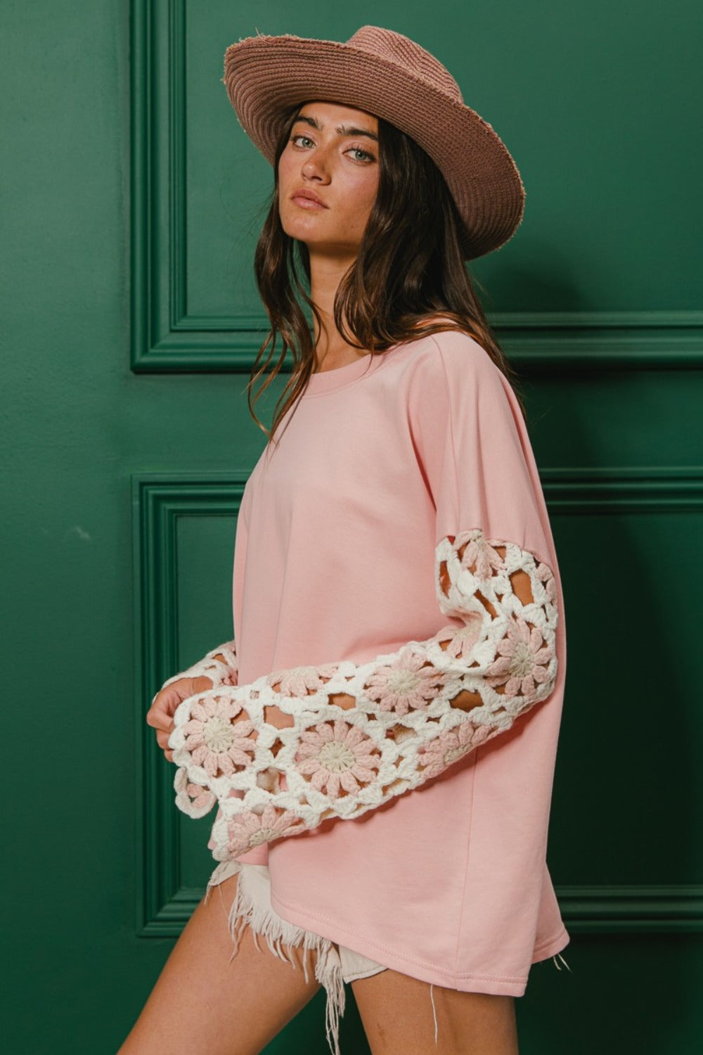 Pink casual top with French terry fabric and crochet sleeves.