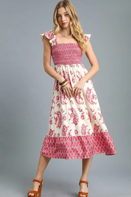 Front view of Isabelle Smocked Floral Midi Dress with ruffle cap sleeves, smocked bodice, and tiered floral skirt.