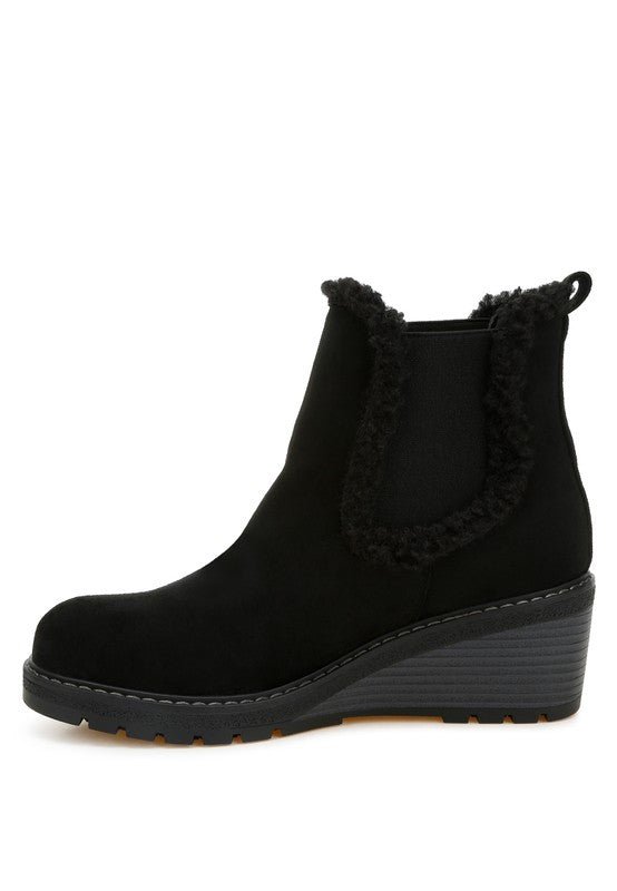 Side view of black Thunderhoof Chelsea Boots with pull tab and cushioned wedge heel.