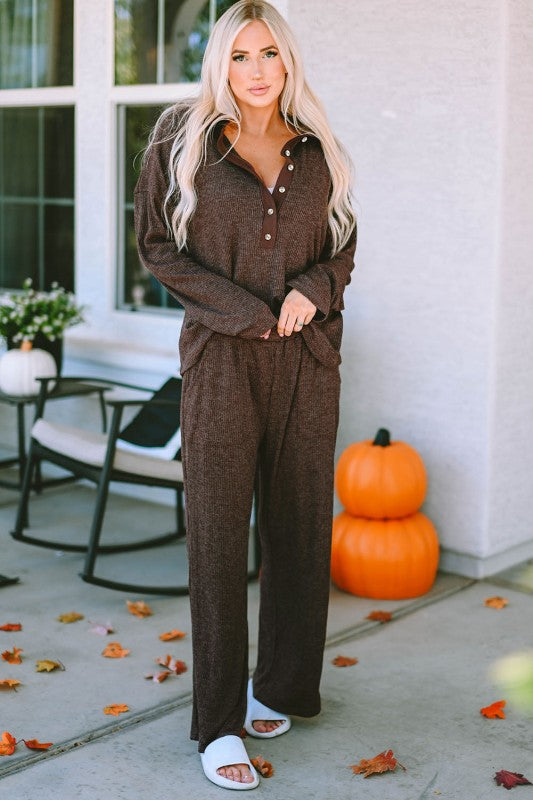 Woman wearing Brooke Ribbed Lounge Set in brown, collared Henley top with buttons and wide-leg pants with pockets