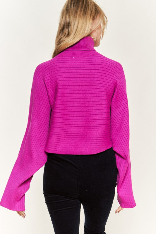 Close-up back Giada Mock Neck Wide Sleeves Sweater in fuchsia showing wide sleeves.