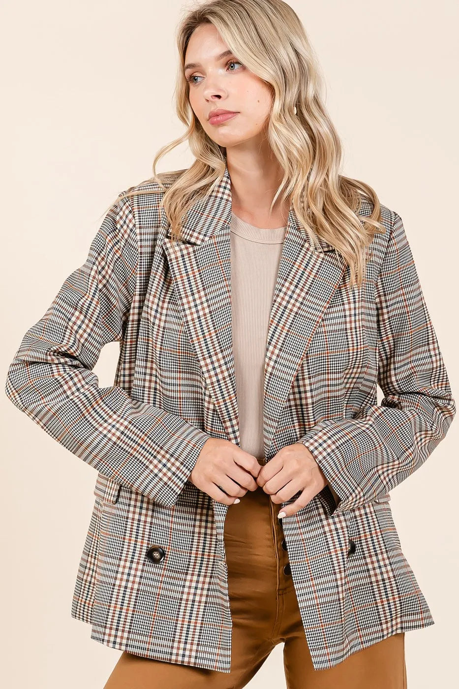Front-facing image of model in unbuttoned Lennon Plaid Blazer paired with brown jeans