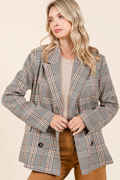Front-facing image of model in unbuttoned Lennon Plaid Blazer paired with brown jeans