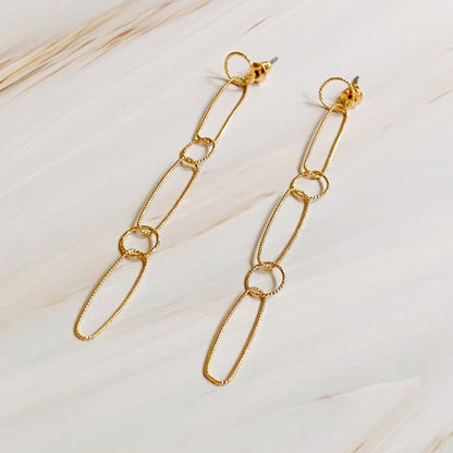 Dainty Chain Link Drop Earrings in gold displayed on soft neutral background