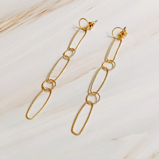Dainty Chain Link Drop Earrings in gold displayed on soft neutral background