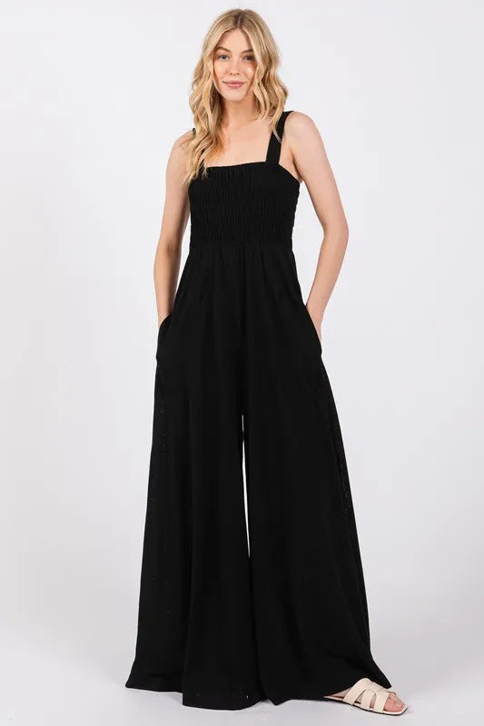 Jamila black wide leg jumpsuit with smocked bodice for a comfortable, stylish fit, perfect for various occasions.