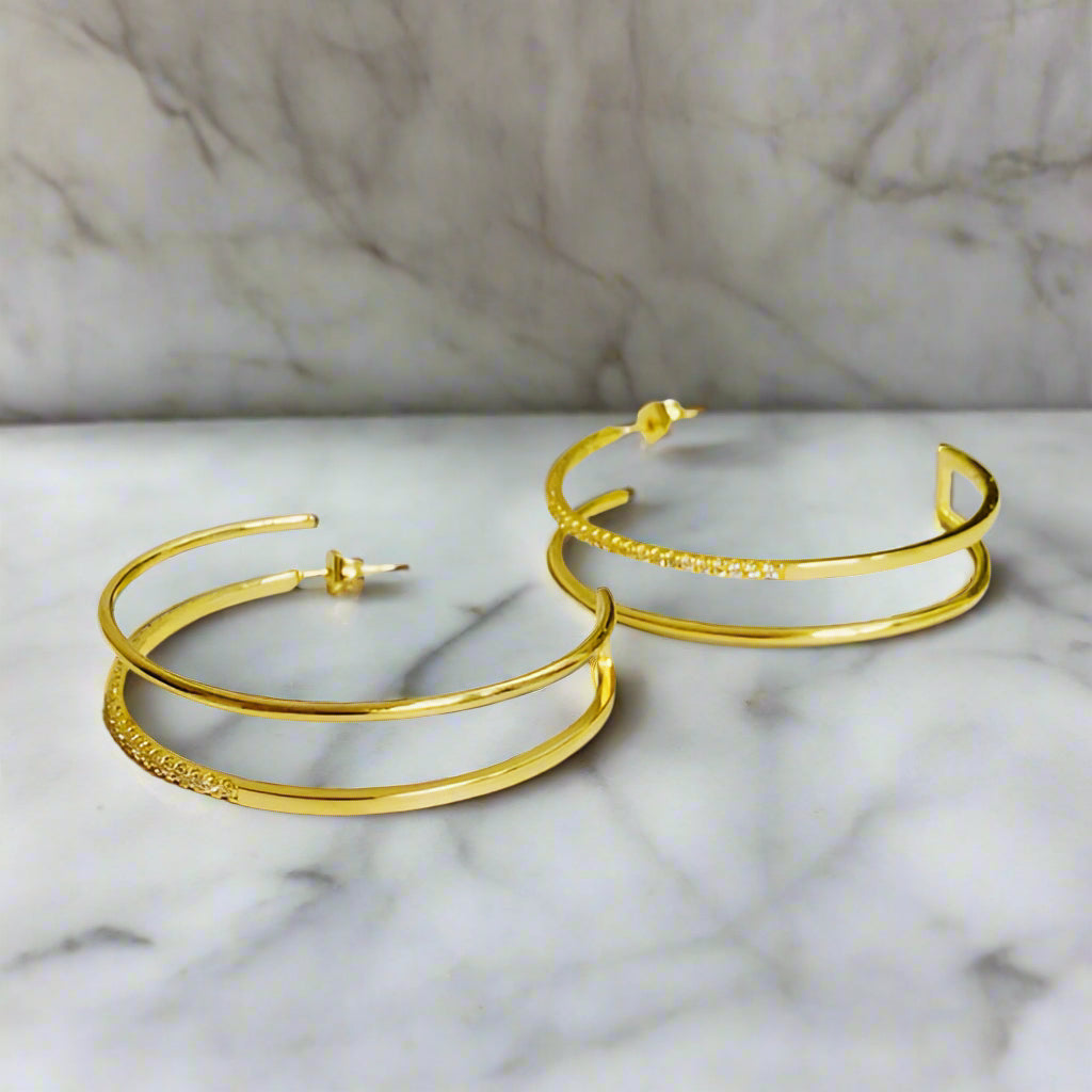 Gold Double Open Top Hoop Earrings with double-hoop silhouette displayed on light neutral surface