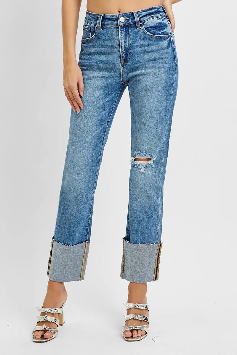Angled front view showing tummy-flattering high rise and trendy wide cuff detail.