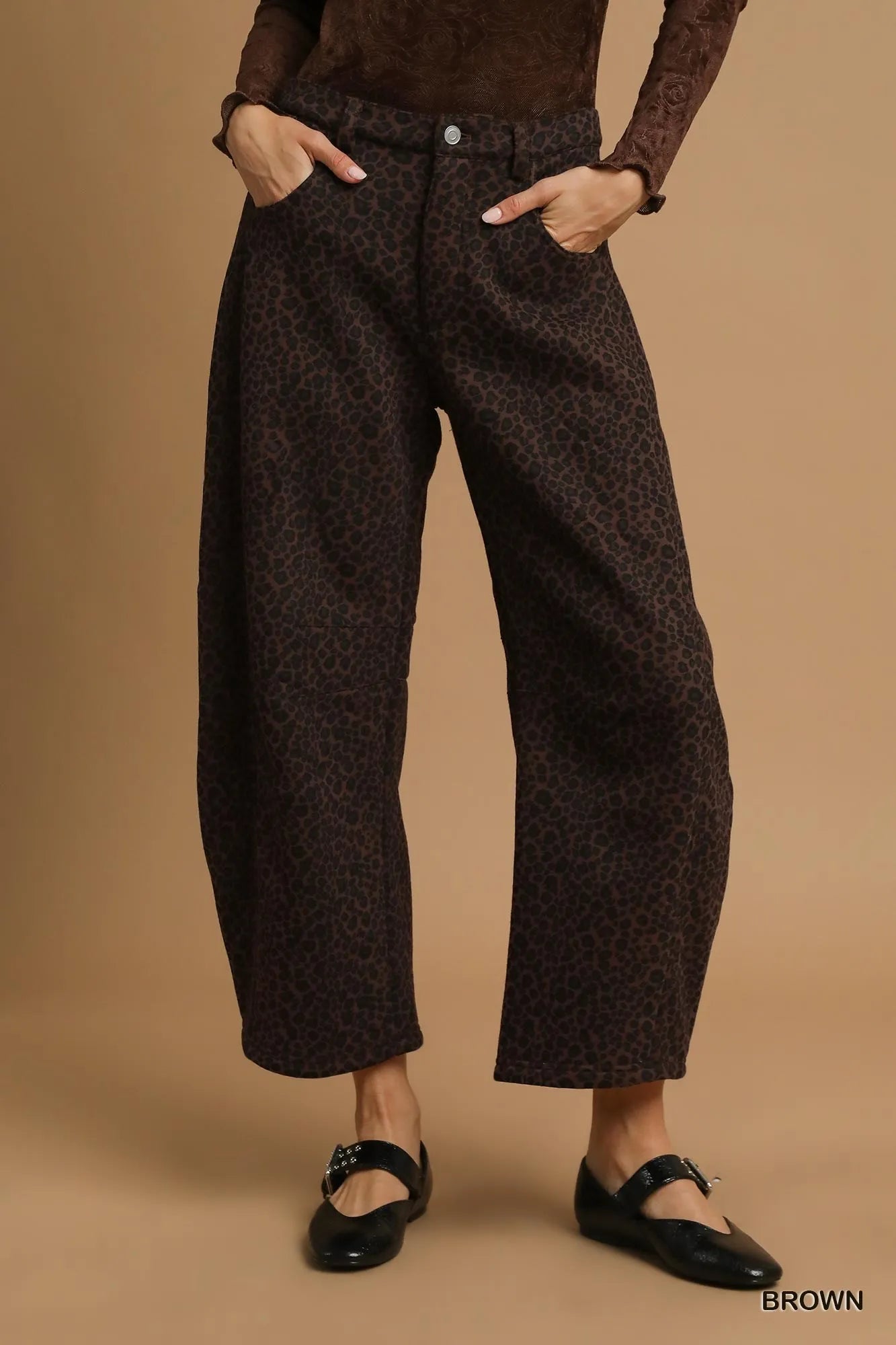 Front view of Finley leopard print pants showing wide leg silhouette and bold pattern.