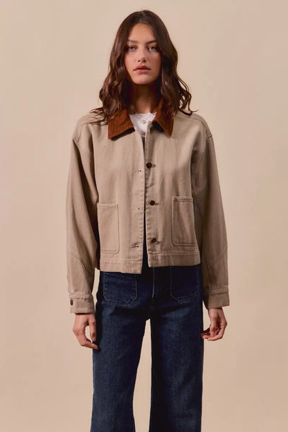 Front view of model wearing Suri Cotton Twill Cropped Barn Jacket open over top, showing modern fit.