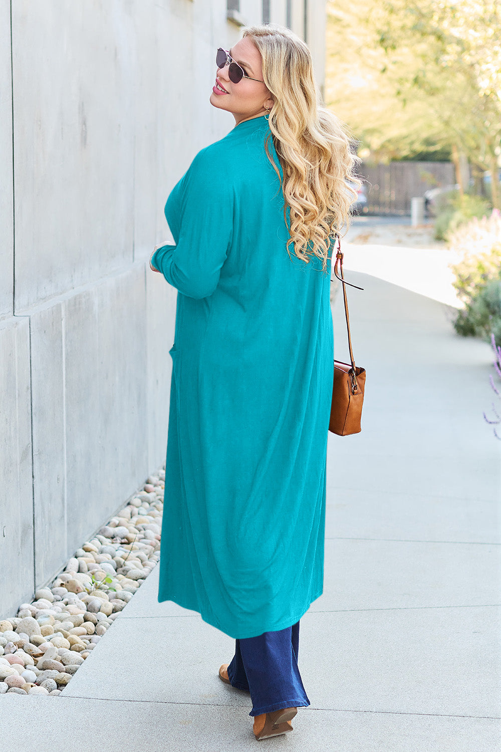 Sky Blue open-front long-sleeve cover-up with a flowy design and pockets, perfect for layering on breezy days.