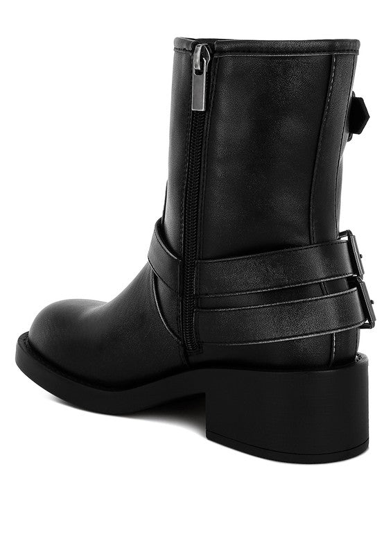 Black Caribou Boots back angle with pull tab, harness detail, and block heel.
