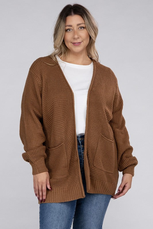 Curvy plus-size waffle-pattern open cardigan sweater in deep camel, with long sleeves, oversized fit, and pockets.