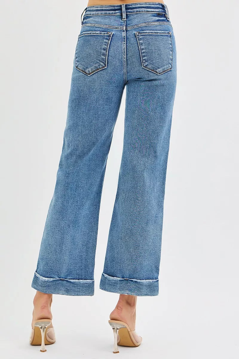 Sammy Mid Rise Crop Straight Jeans Risen Medium Wash back view showing raw hem cuff.