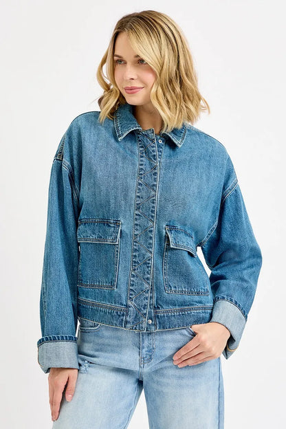 Blue oversized collared denim jacket with pocket details and no-stretch fabric for sturdy structure.