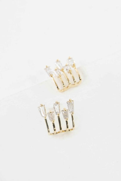 Close-up of Kalimba Gold Baguette Post Earrings featuring five baguette-cut stones in a row with a warm gold finish.