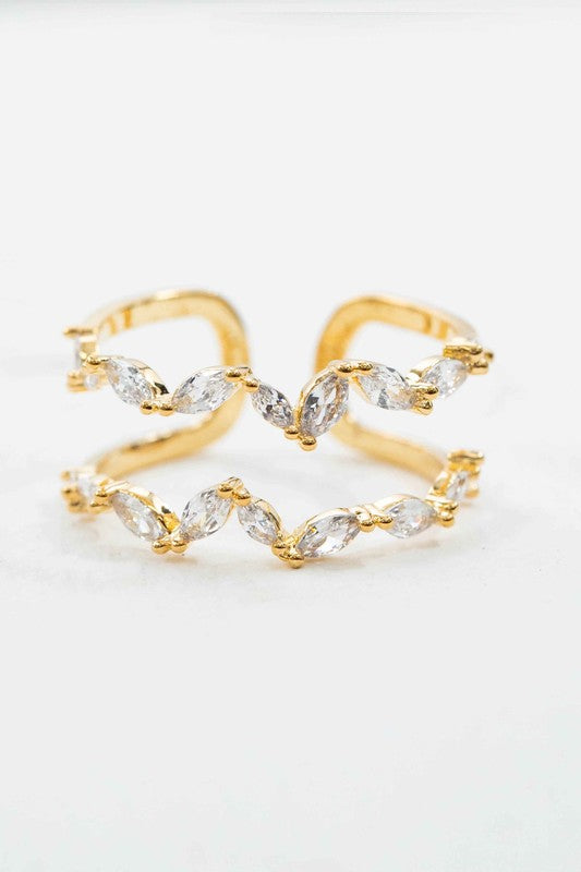 Front view of gold double-layer ring with sparkling petal stones in a wave-like design.