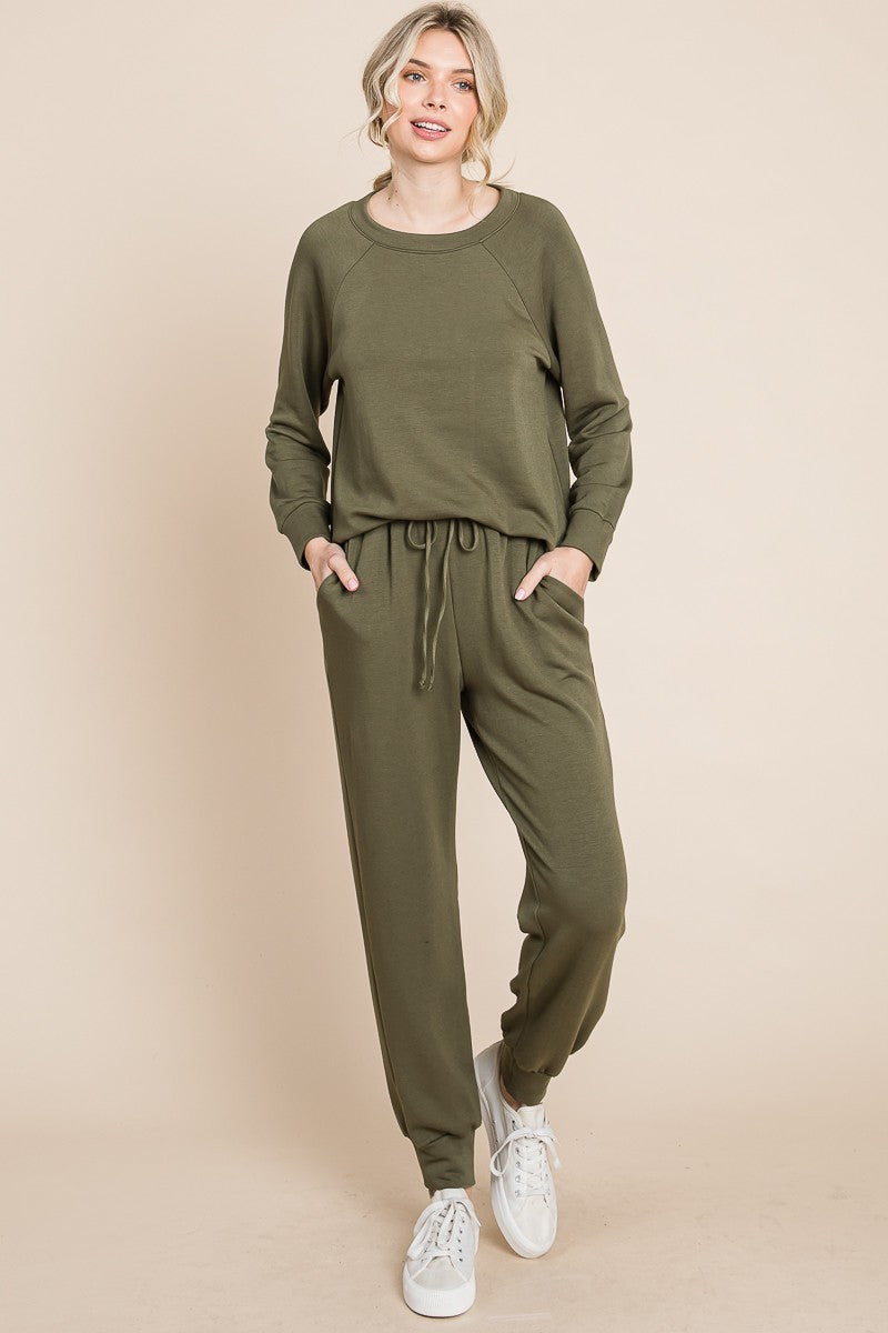 Olive lounge set with a round-neck top, raglan sleeves, and drawstring pants.