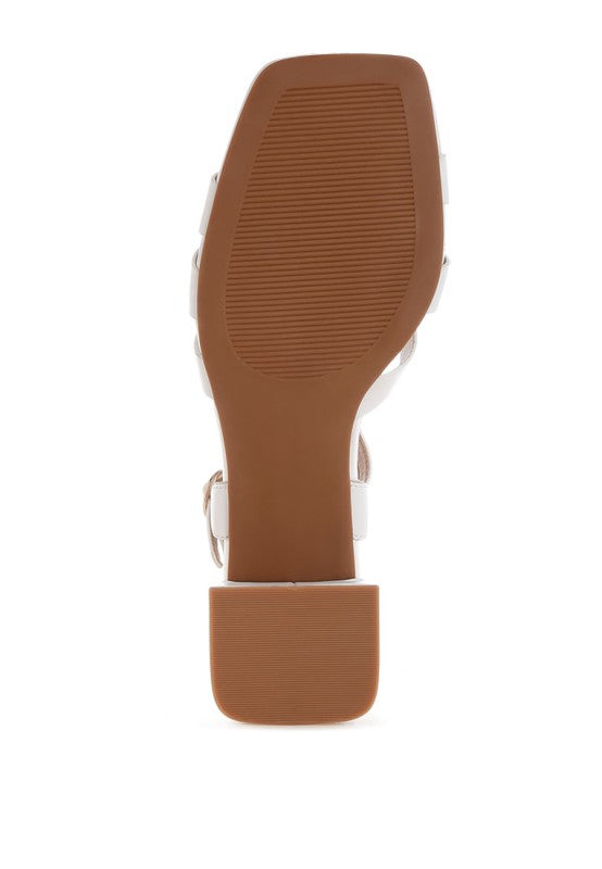Bottom sole view of white Eliska Strappy Block Heels with TP rubber outsole.