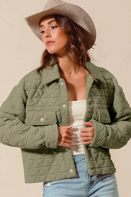 Model wearing Serina Quilted Snap Jacket in olive with diamond stitching.