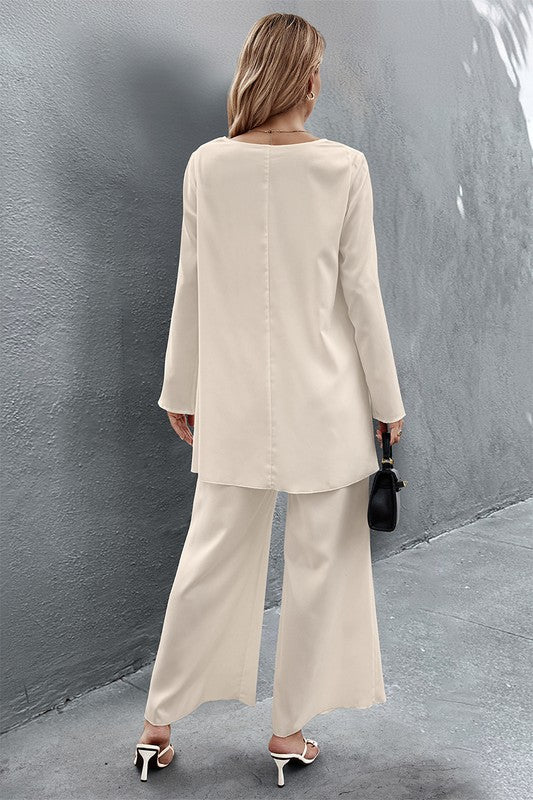 8. Back view of Nikita Two Piece Set in crème showing straight back seam and wide leg pants