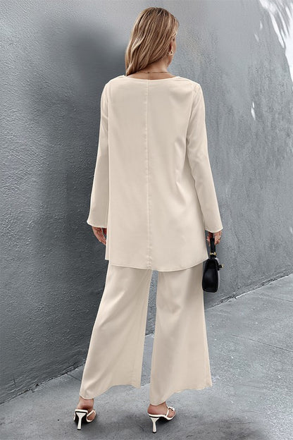 8. Back view of Nikita Two Piece Set in crème showing straight back seam and wide leg pants