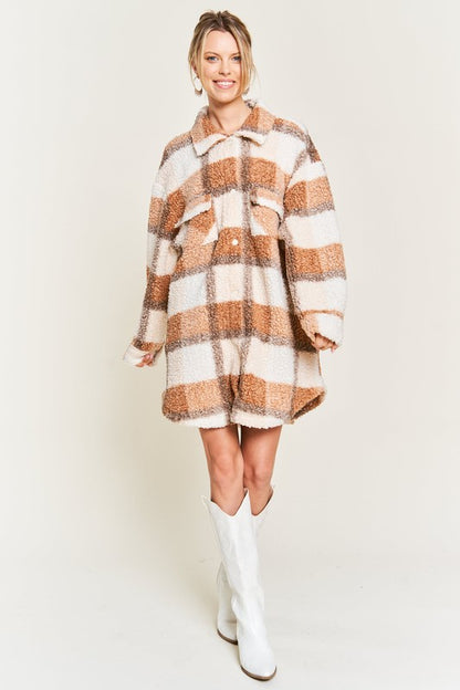 Full body front view of Sariya Plus Size Teddy Jacket in brown plaid styled with white boots.