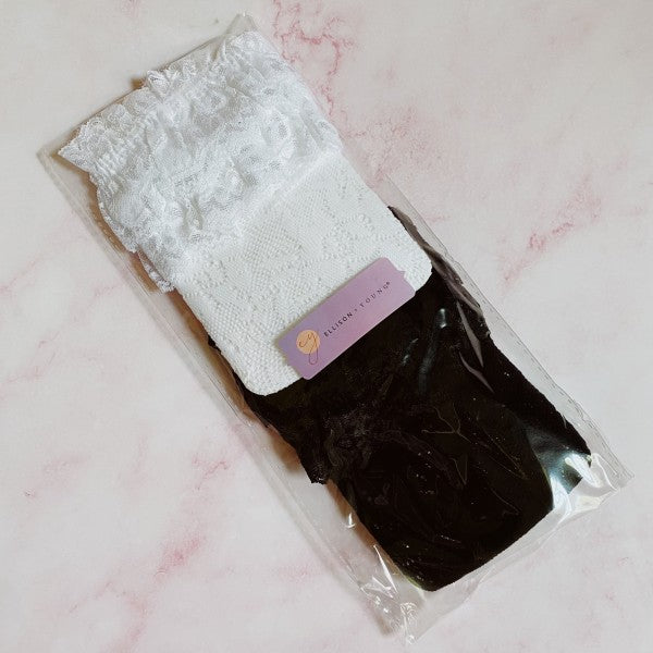 Packaged 80’s Lace Socks Set of 2 with one black pair and one white pair.