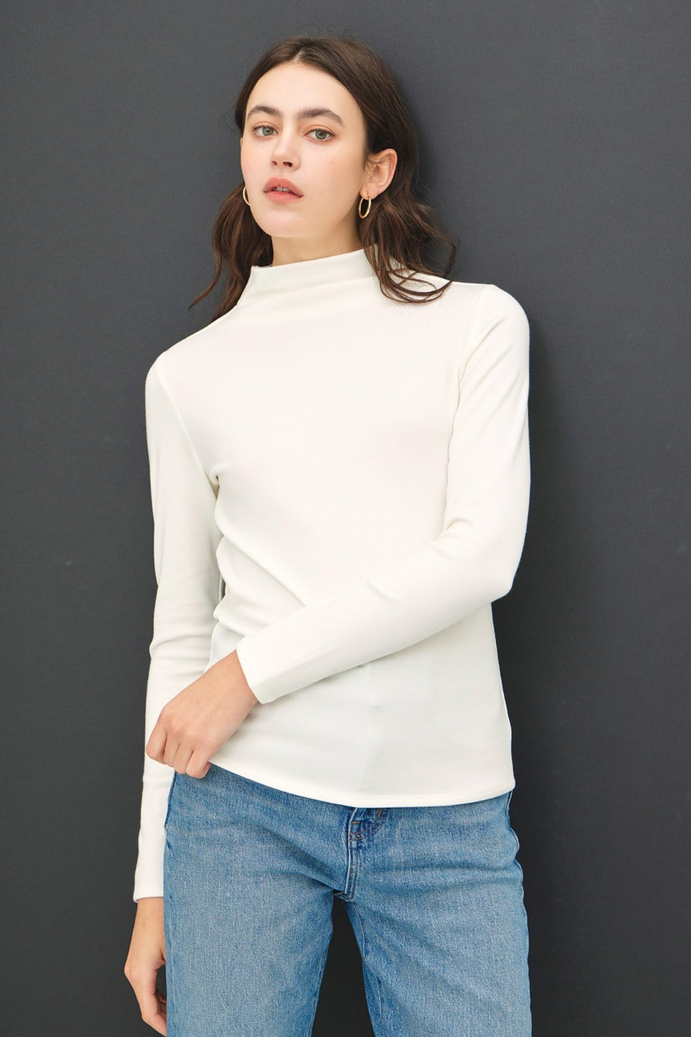 Ivory mock neck long sleeve t-shirt in soft, stretchy fabric.