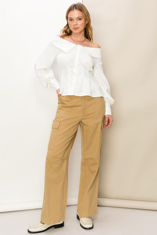 Khaki high-waisted cargo pants with a straight-leg fit, functional side pockets, and zip fly.