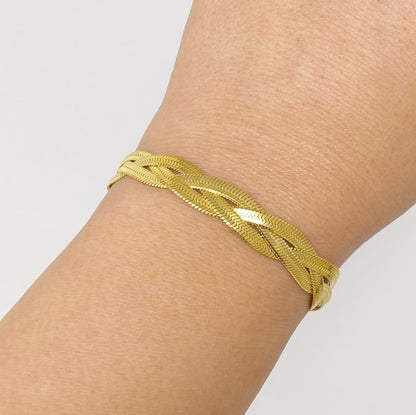 Braided Herringbone Chain Bracelet in gold on model's wrist.