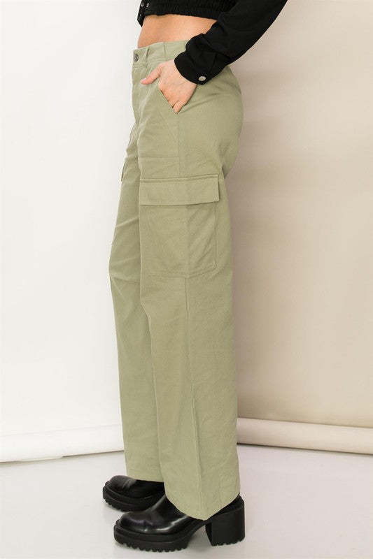 Sage high-waisted cargo pants with a straight-leg fit, functional side pockets, and zip fly.