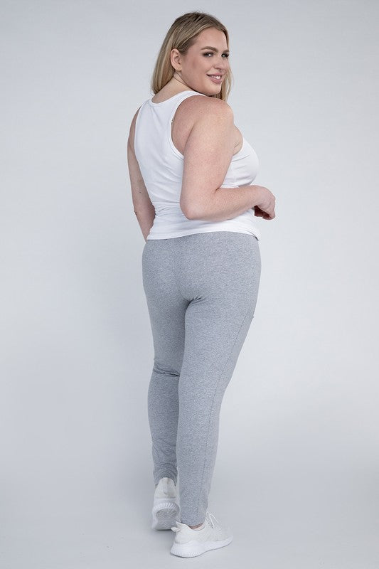 Full-length curvy plus leggings in Heather gray with a high-rise thick waistband, fitted silhouette, and convenient leg pockets.