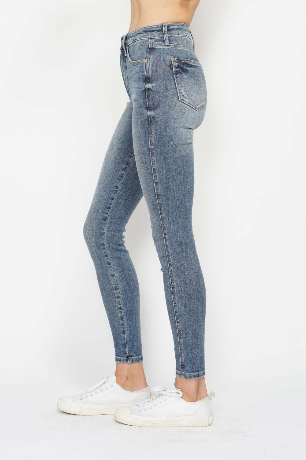 Tummy Control Contrast Wash Skinny Jeans by Judy Blue in medium wash. High waist with tummy control panel, skinny leg silhouette, and moderate stretch for comfort and style. Versatile and flattering