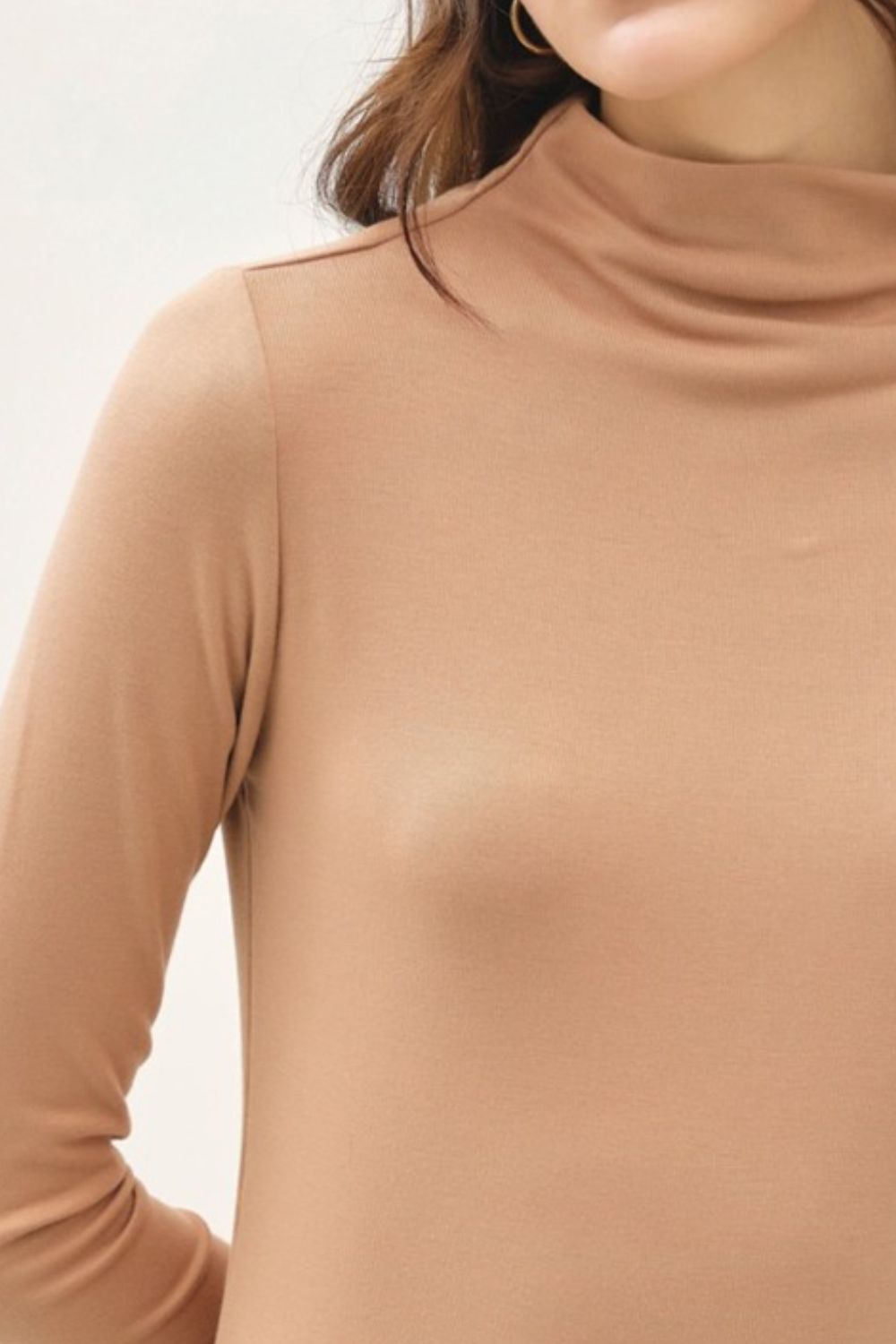 Camel mock neck long sleeve t-shirt in soft, stretchy fabric.