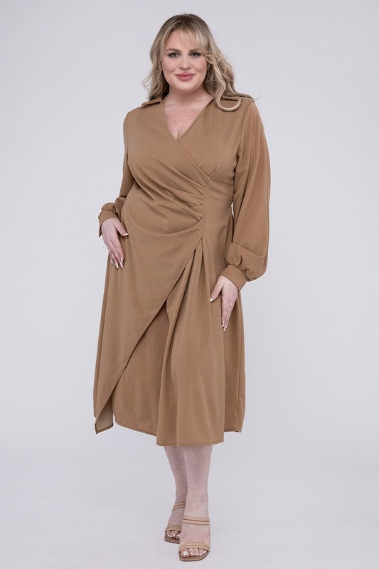 Camel colored wrap dress with twist front detail, collared V-neckline, and bishop sleeves. Features gentle ruching and midi length.