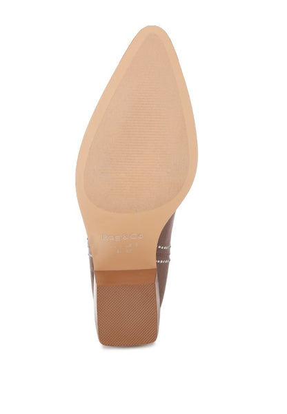 Sole view of cowboy boot with textured rubber bottom and block heel