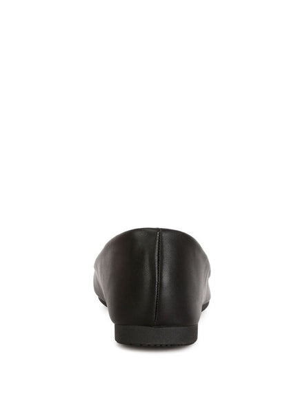 Back view of black ballet flats highlighting slip-on design
