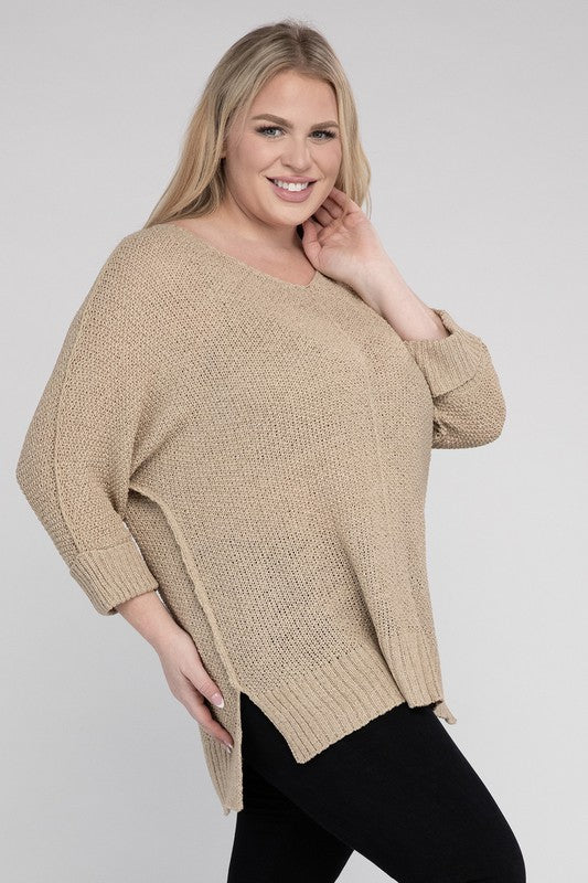 Oatmeal plus size crew neck sweater with a loose fit, side slits, long sleeves, and a cozy knit fabric for warmth.