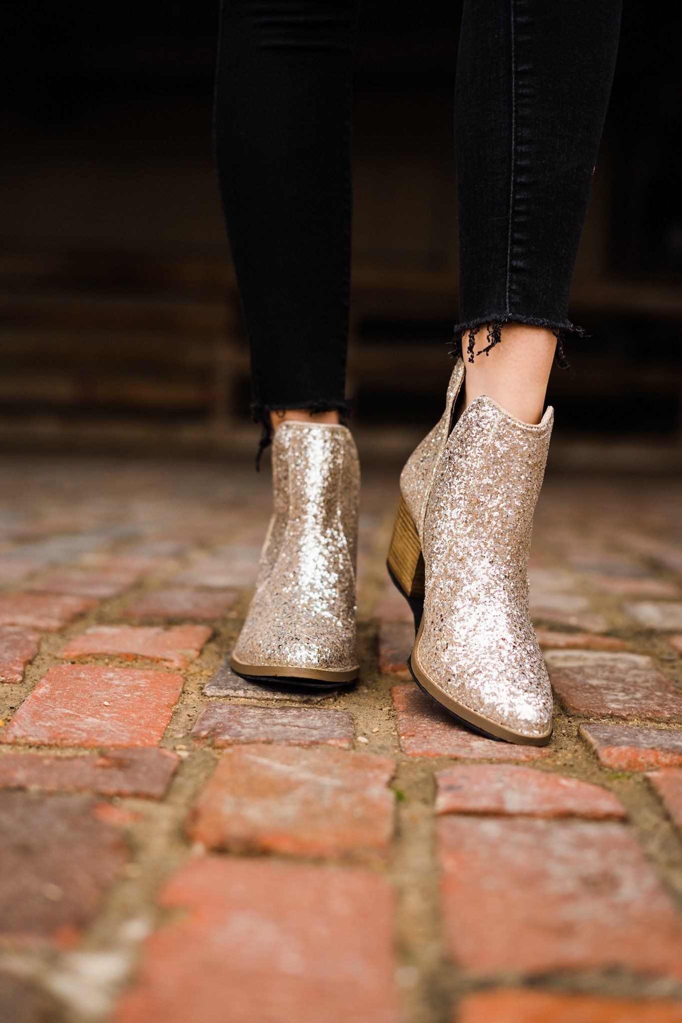 Gold glitter booties with a 3-inch heel, rubber soles, and a sparkling finish for a glamorous party look.