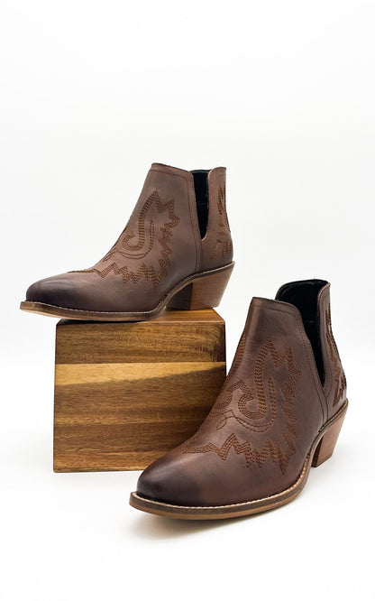 Brown leather booties with Western embroidery, roomy snip toe, cushioned footbed, and ankle slits.